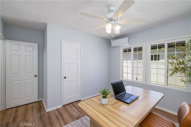 12108 Dunrobin Ave, Downey, CA 90242 - office featuring a wall unit AC, wood finished floors, ceiling fan, and a textured ceiling