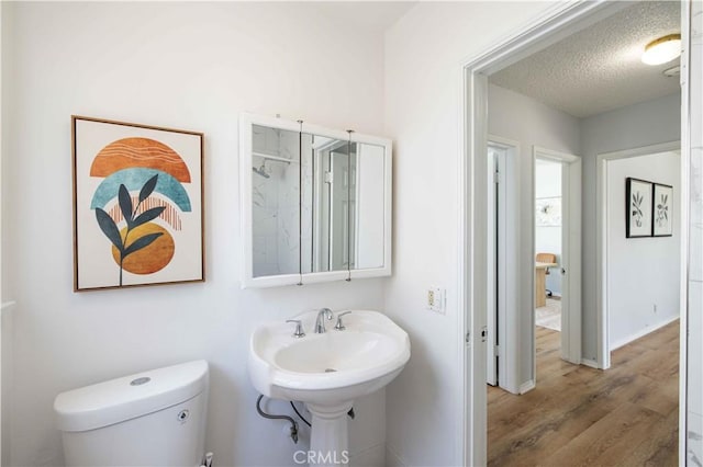 12108 Dunrobin Ave, Downey, CA 90242 - bathroom featuring wood finished floors and a textured ceiling