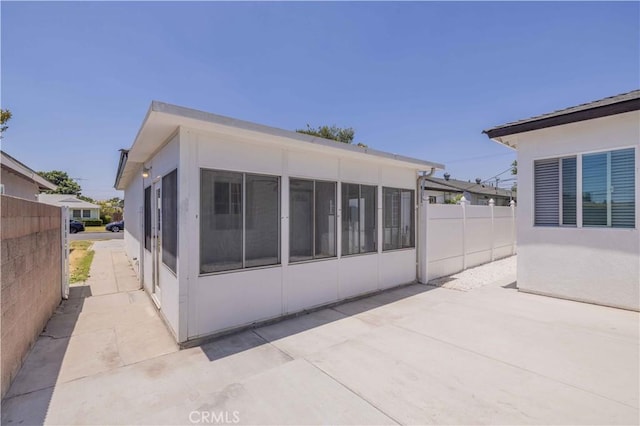 12108 Dunrobin Ave, Downey, CA 90242 - rear view of property featuring a sunroom and a patio