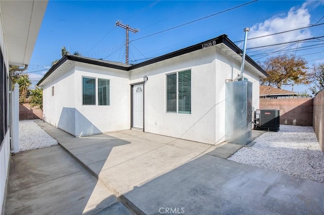 12108 Dunrobin Ave, Downey, CA 90242 - back of house with a fenced backyard, a patio, and stucco siding