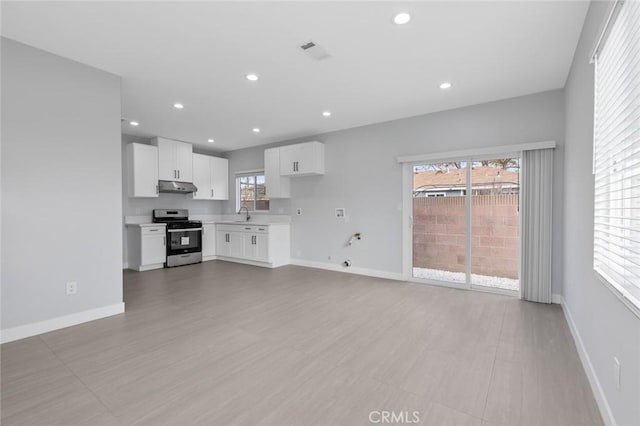 12108 Dunrobin Ave, Downey, CA 90242 - unfurnished living room featuring recessed lighting and light wood-type flooring