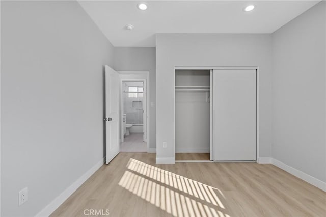 12108 Dunrobin Ave, Downey, CA 90242 - unfurnished bedroom featuring wood finished floors, a closet, and recessed lighting