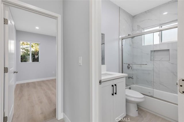 12108 Dunrobin Ave, Downey, CA 90242 - full bath with vanity, enclosed tub / shower combo, wood finished floors, and recessed lighting