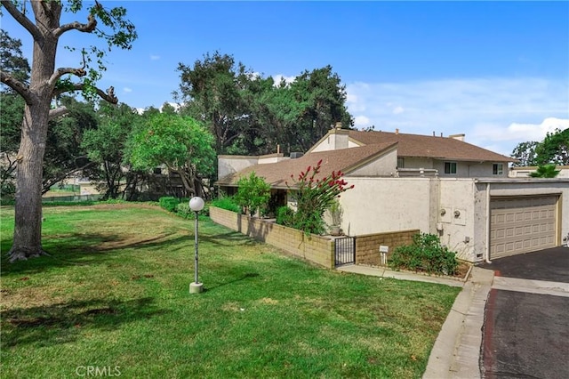 19950 Esquiline Ave, Walnut, CA 91789 - view of property exterior with asphalt driveway, stucco siding, an attached garage, and a gate