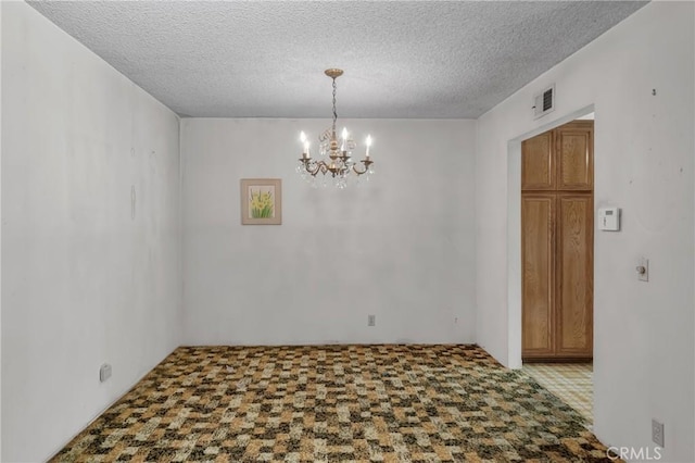 19950 Esquiline Ave, Walnut, CA 91789 - carpeted empty room with a chandelier and a textured ceiling