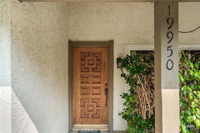 19950 Esquiline Ave, Walnut, CA 91789 - doorway to property with stucco siding