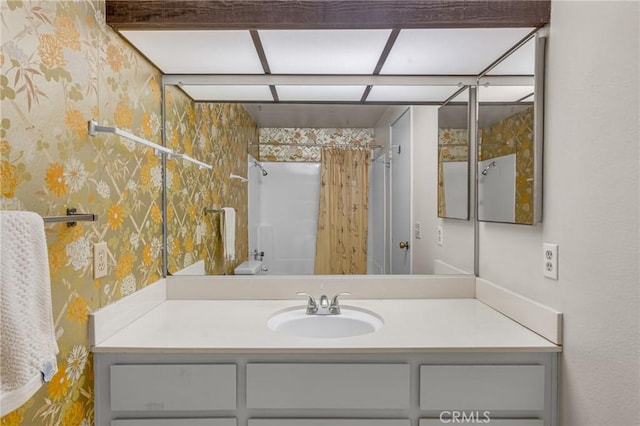 19950 Esquiline Ave, Walnut, CA 91789 - bathroom with wallpapered walls, vanity, and curtained shower