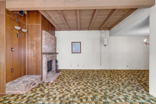 19950 Esquiline Ave, Walnut, CA 91789 - unfurnished living room with a wooden ceiling with exposed beams, a brick fireplace, and wooden walls