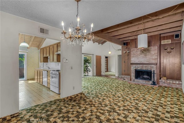 19950 Esquiline Ave, Walnut, CA 91789 - kitchen featuring white appliances, a chandelier, a brick fireplace, open floor plan, and pendant lighting