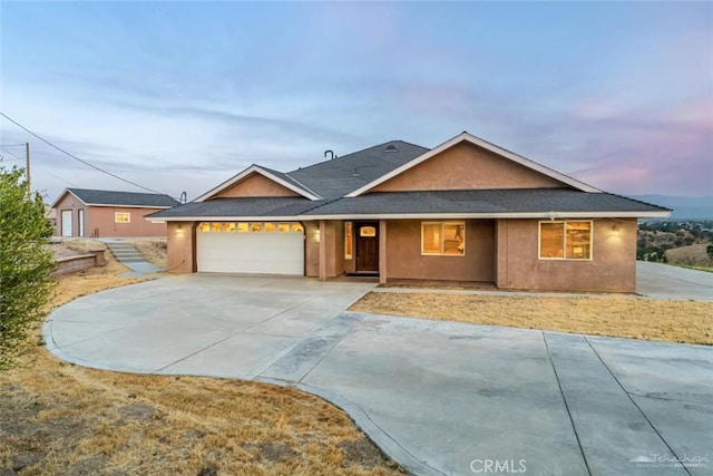 23309 Tak Ct, Tehachapi, CA 93561 - single story home with a garage, concrete driveway, roof with shingles, and stucco siding