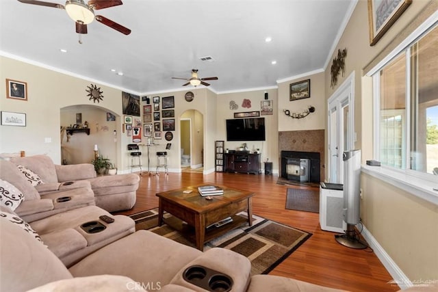 23309 Tak Ct, Tehachapi, CA 93561 - living area featuring a ceiling fan, arched walkways, crown molding, recessed lighting, and wood finished floors