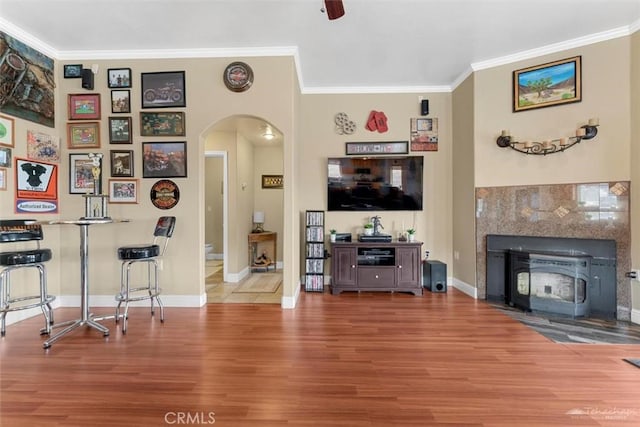 23309 Tak Ct, Tehachapi, CA 93561 - living area featuring arched walkways, wood finished floors, and ornamental molding
