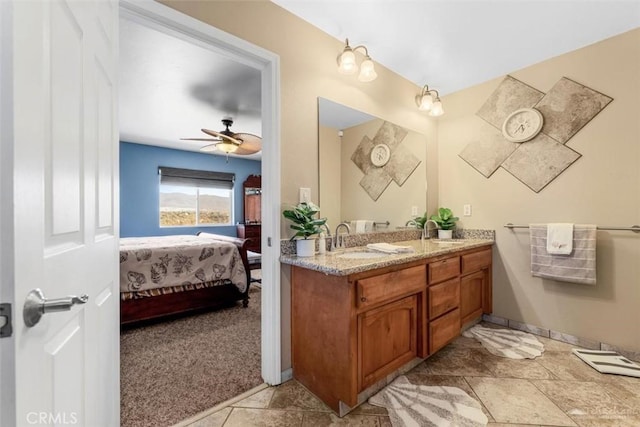 23309 Tak Ct, Tehachapi, CA 93561 - full bathroom with double vanity, connected bathroom, and a ceiling fan