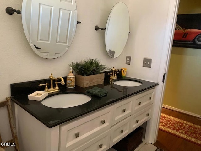 20151 Serrano Rd, Apple Valley, CA 92307 - bathroom with double vanity and wood finished floors