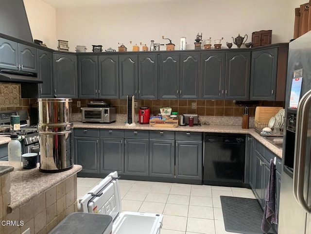 20151 Serrano Rd, Apple Valley, CA 92307 - kitchen with stainless steel appliances, under cabinet range hood, backsplash, light tile patterned floors, and light countertops