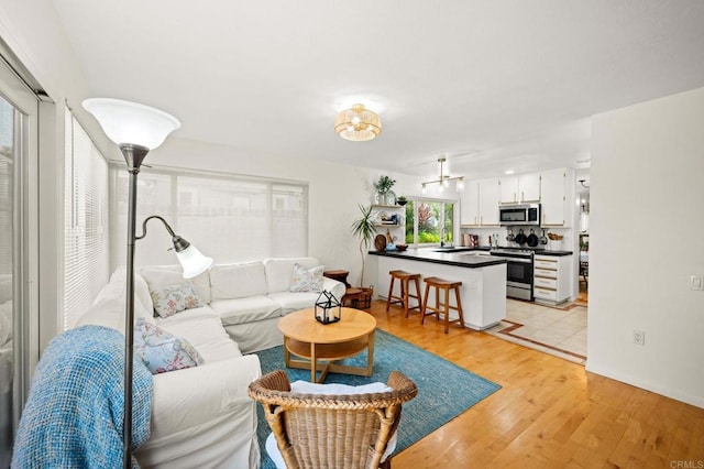 3432 Mount Ariane Dr, San Diego, CA 92111 - living room featuring light wood-style floors