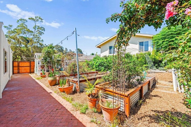 3432 Mount Ariane Dr, San Diego, CA 92111 - view of yard with a garden and a gate