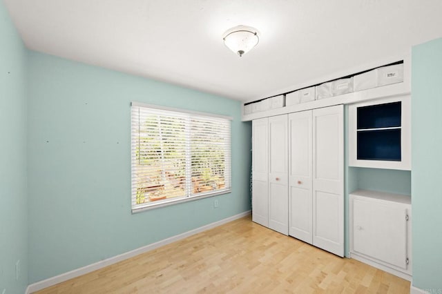 3432 Mount Ariane Dr, San Diego, CA 92111 - unfurnished bedroom with a closet and wood finished floors