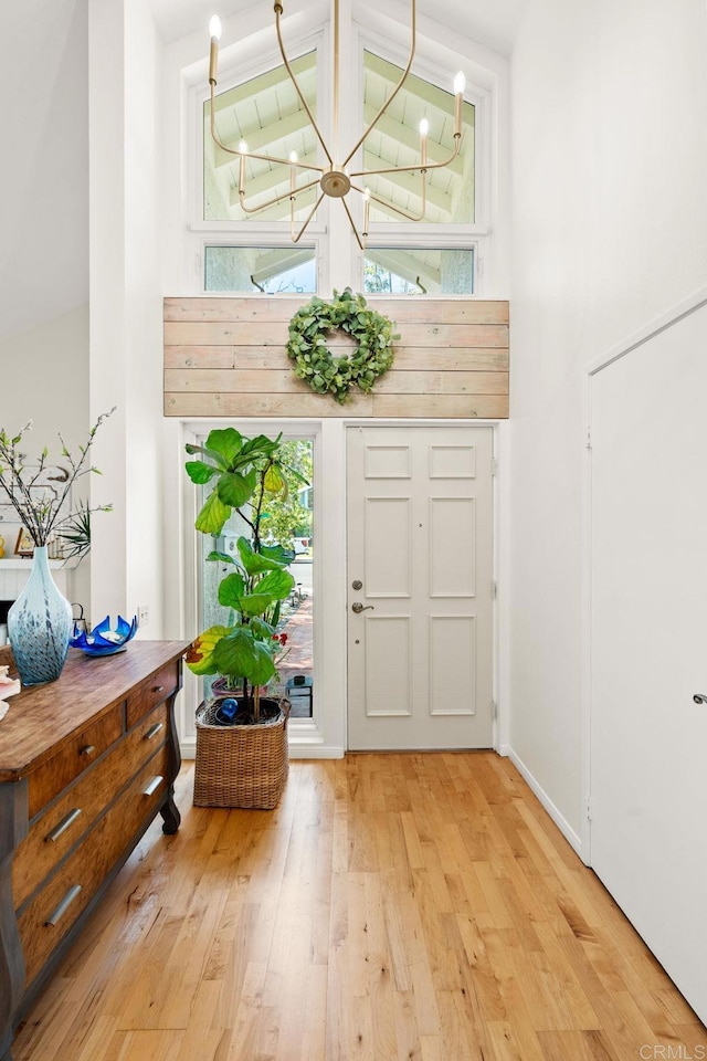 3432 Mount Ariane Dr, San Diego, CA 92111 - foyer entrance with a chandelier, light wood finished floors, and lofted ceiling