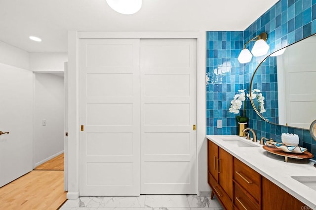 3432 Mount Ariane Dr, San Diego, CA 92111 - full bath with double vanity, marble look tiles, and recessed lighting