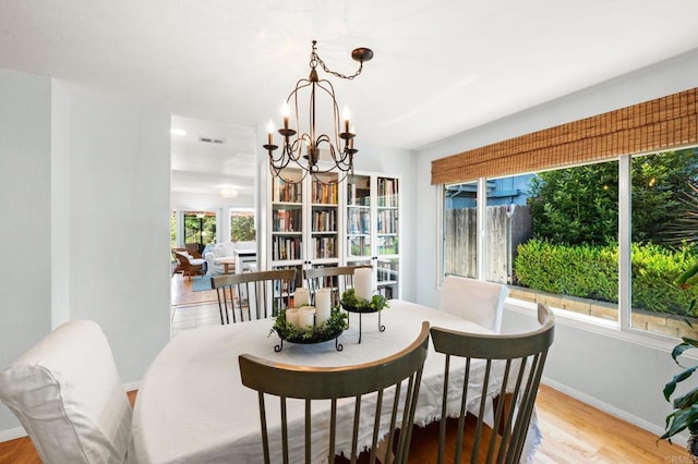 3432 Mount Ariane Dr, San Diego, CA 92111 - dining room featuring a chandelier and light wood finished floors