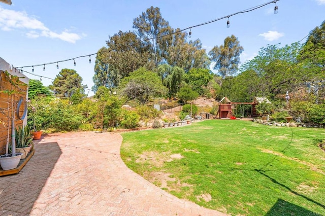 3432 Mount Ariane Dr, San Diego, CA 92111 - view of green lawn featuring a patio