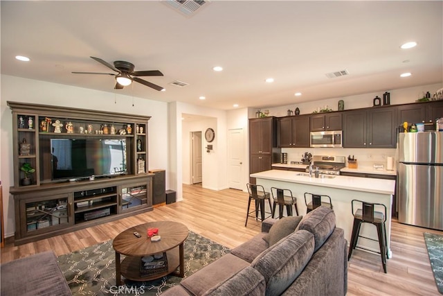 29392 Tourmaline Way, Winchester, CA 92596 - living room with light wood-style floors, a ceiling fan, and recessed lighting