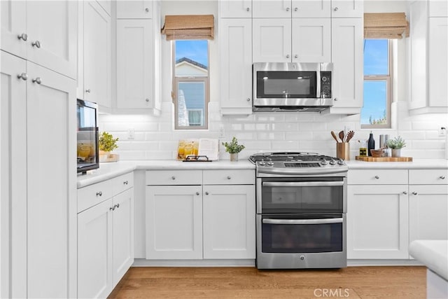 38 Marisol St, Rancho Mission Viejo, CA 92694 - kitchen featuring stainless steel appliances, light countertops, and white cabinetry
