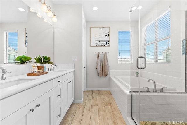 38 Marisol St, Rancho Mission Viejo, CA 92694 - bathroom with double vanity, a garden tub, wood finished floors, recessed lighting, and a shower with shower door