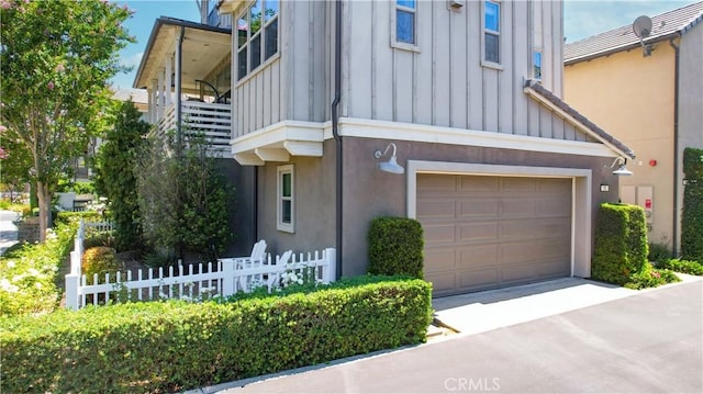 38 Marisol St, Rancho Mission Viejo, CA 92694 - view of home's exterior with board and batten siding, a garage, concrete driveway, and stucco siding