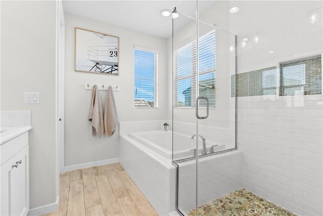 38 Marisol St, Rancho Mission Viejo, CA 92694 - bathroom with a bath, a shower stall, vanity, and wood finished floors