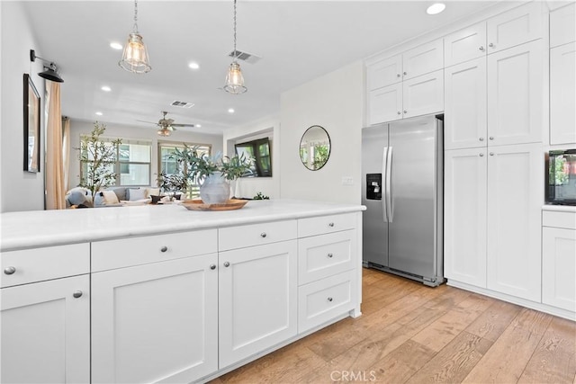 38 Marisol St, Rancho Mission Viejo, CA 92694 - kitchen featuring stainless steel refrigerator with ice dispenser, recessed lighting, light wood-type flooring, white cabinetry, and light countertops