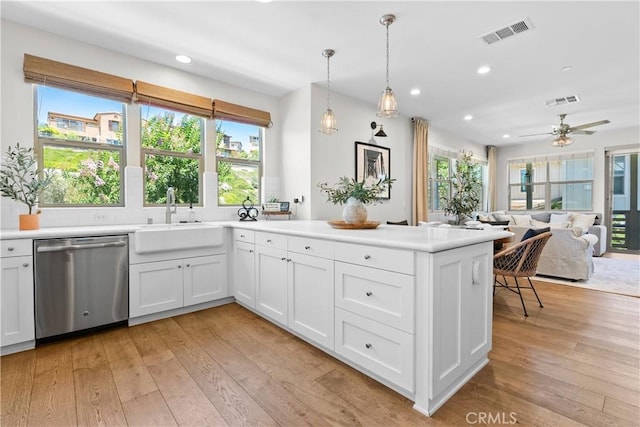 38 Marisol St, Rancho Mission Viejo, CA 92694 - kitchen featuring stainless steel dishwasher, a peninsula, recessed lighting, light wood-type flooring, and white cabinetry