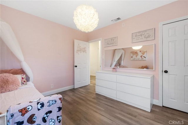 8626 Stark St, Riverside, CA 92504 - bedroom featuring a chandelier and wood finished floors