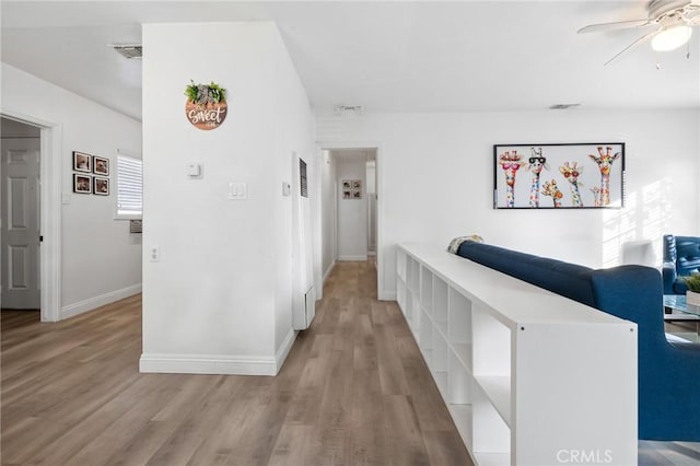 8626 Stark St, Riverside, CA 92504 - hallway with light wood-style flooring and baseboards