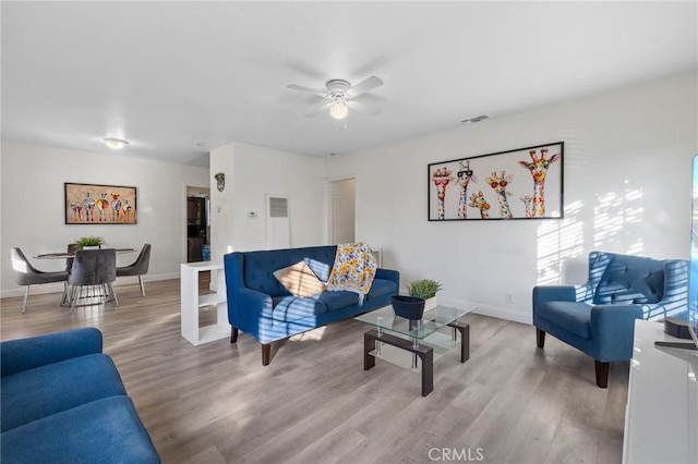 8626 Stark St, Riverside, CA 92504 - living room featuring a ceiling fan and wood finished floors
