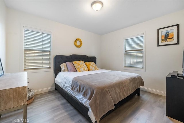8626 Stark St, Riverside, CA 92504 - bedroom with wood finished floors and baseboards