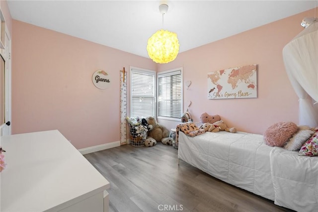 8626 Stark St, Riverside, CA 92504 - bedroom featuring wood finished floors and a chandelier