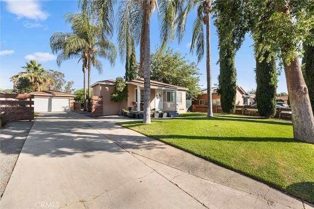 8626 Stark St, Riverside, CA 92504 - ranch-style home with stucco siding, an outbuilding, a front yard, and a garage