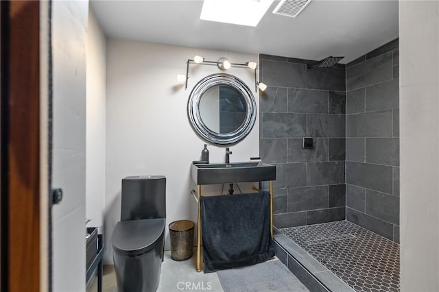 8626 Stark St, Riverside, CA 92504 - bathroom with a tile shower and concrete floors
