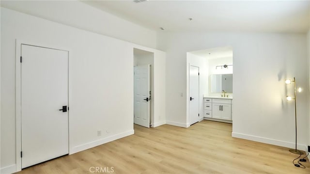 8810 Hewitt Pl Unit 2, Garden Grove, CA 92844 - unfurnished bedroom with lofted ceiling, light wood-type flooring, and connected bathroom