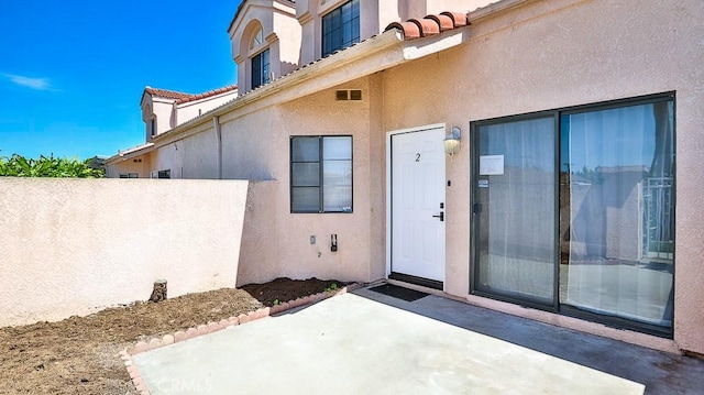 8810 Hewitt Pl Unit 2, Garden Grove, CA 92844 - property entrance featuring a patio, a tiled roof, and stucco siding