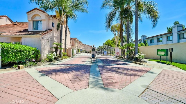 8810 Hewitt Pl Unit 2, Garden Grove, CA 92844 - view of decorative street with a gate, a gated entry, curbs, and a residential view