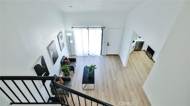 8810 Hewitt Pl Unit 2, Garden Grove, CA 92844 - living area featuring light wood-style flooring and stairway