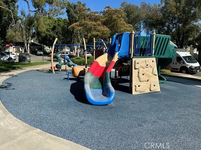 6080 Cape Cod Ln Unit 54, Yorba Linda, CA 92887 - communal playground featuring view of wooded area
