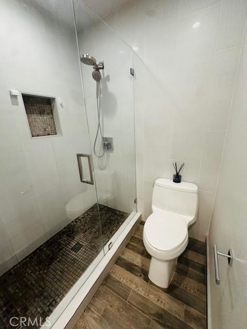 6080 Cape Cod Ln Unit 54, Yorba Linda, CA 92887 - full bathroom with a stall shower and wood finished floors