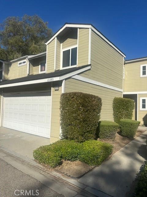 6080 Cape Cod Ln Unit 54, Yorba Linda, CA 92887 - view of home's exterior with a garage and driveway