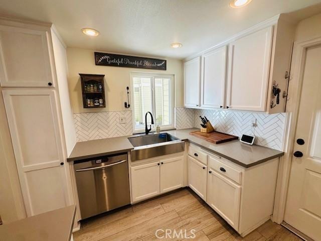 6080 Cape Cod Ln Unit 54, Yorba Linda, CA 92887 - kitchen featuring stainless steel dishwasher, backsplash, light wood-style flooring, white cabinetry, and recessed lighting