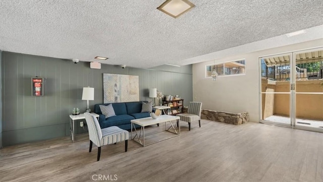 1115 Cordova St Unit 207, Pasadena, CA 91106 - living room featuring a textured ceiling and wood finished floors