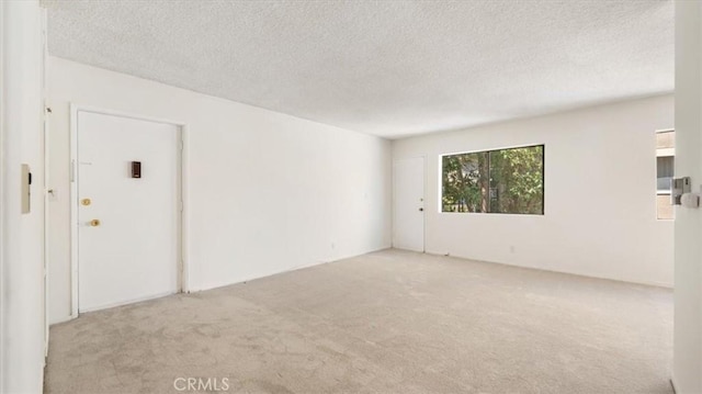 1115 Cordova St Unit 207, Pasadena, CA 91106 - unfurnished room featuring carpet floors and a textured ceiling